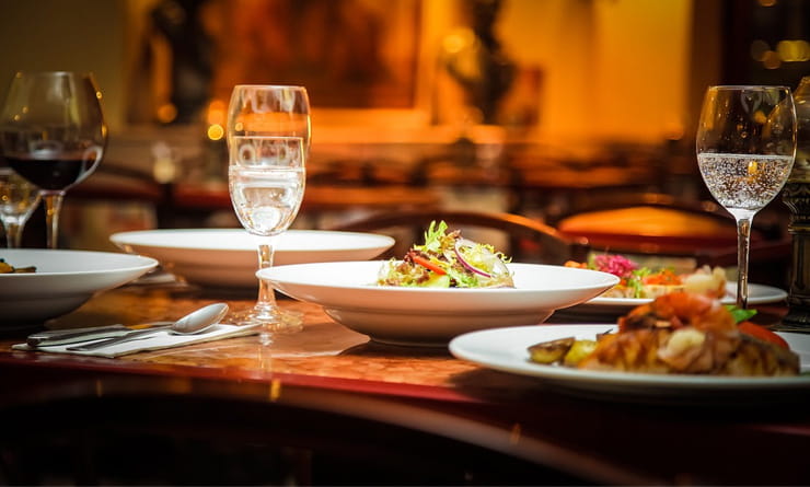 Restaurant Table Set With Dishes