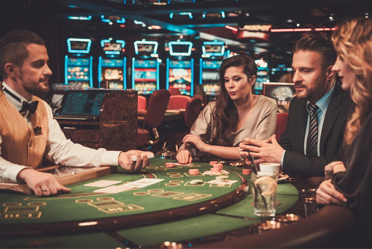 Two Females & a Male Playing Cards