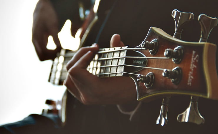 Man Playing of Bass Guitar