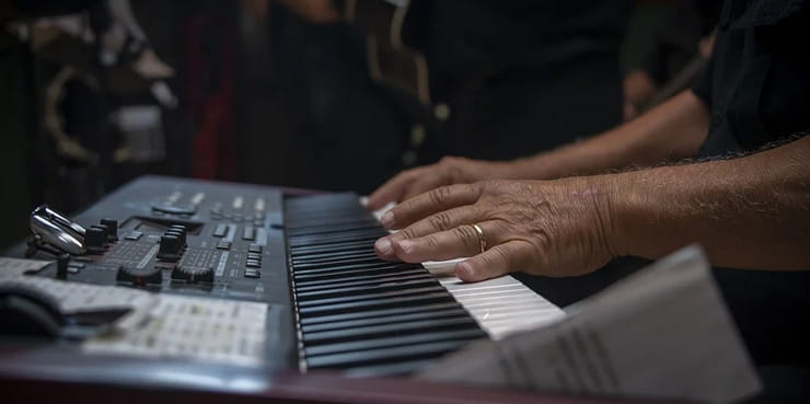 Man Playing Electric Pianno